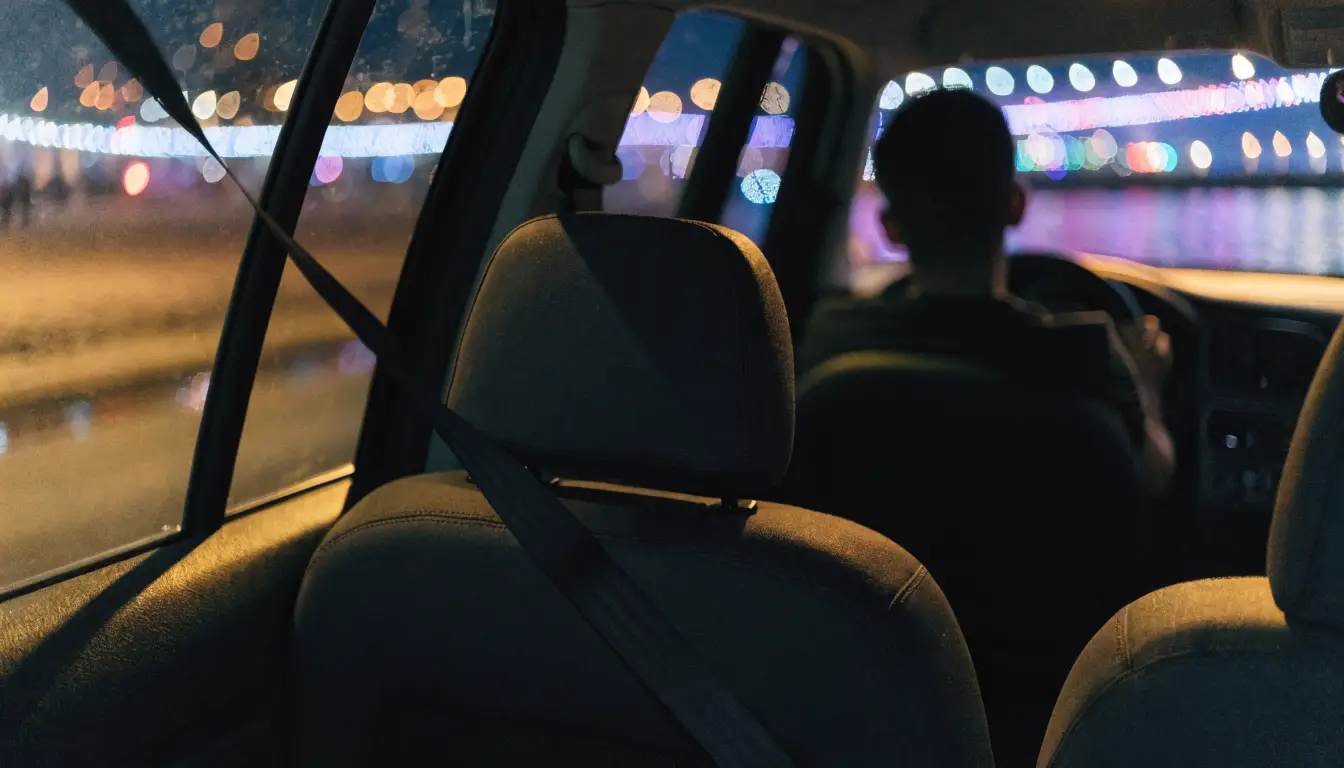 The back seat of a rideshare at night in Oceanside, where injured passengers hold the cleanest claims